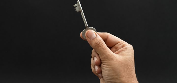 Hand holding a key